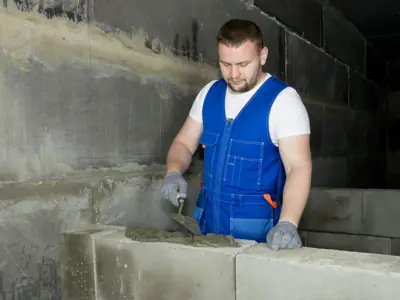 Builder laying blockwork