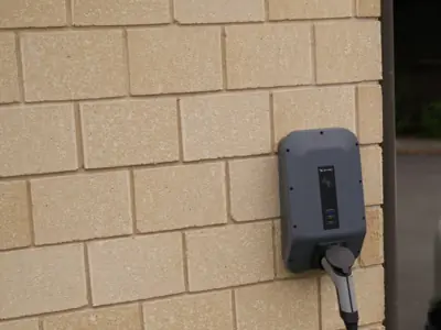 Home EV charger on a brick wall